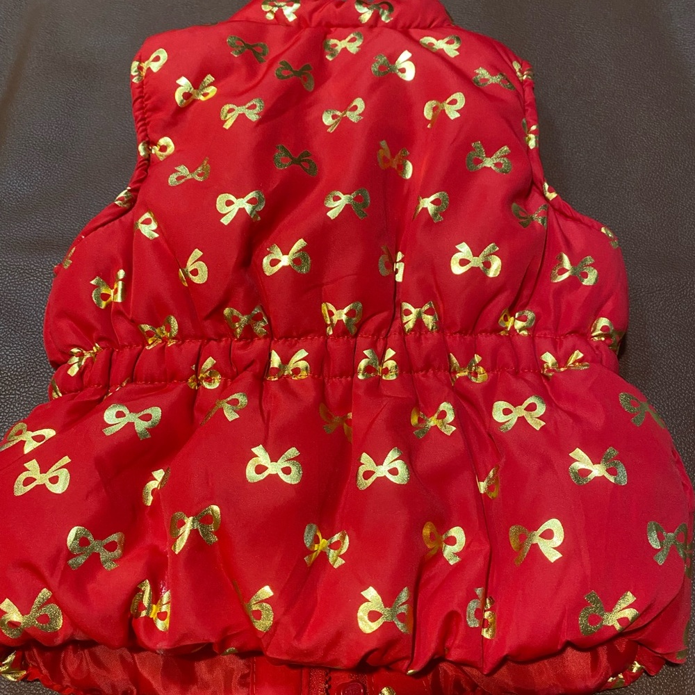 Red Puffer Vest with Gold Bow Pattern - Picture 4 of 6